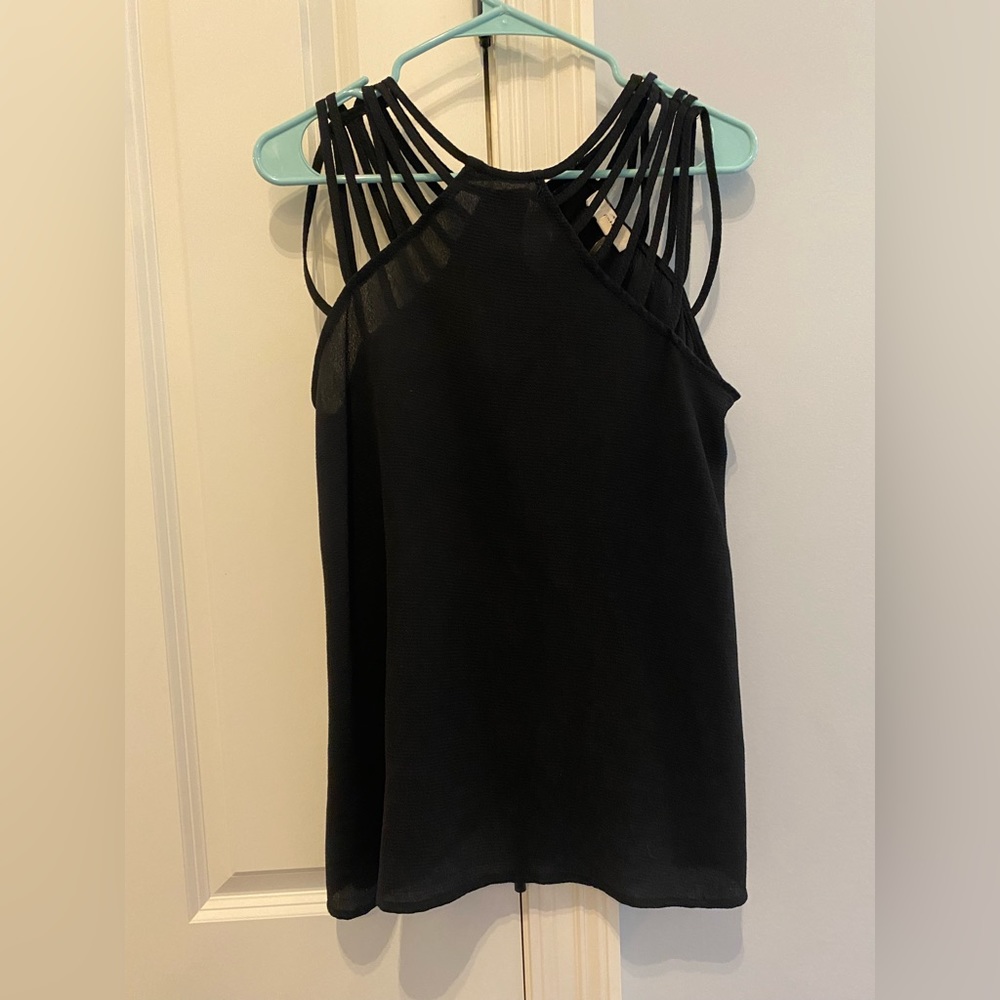 Super cute black tank top with strappy straps. Size Small.